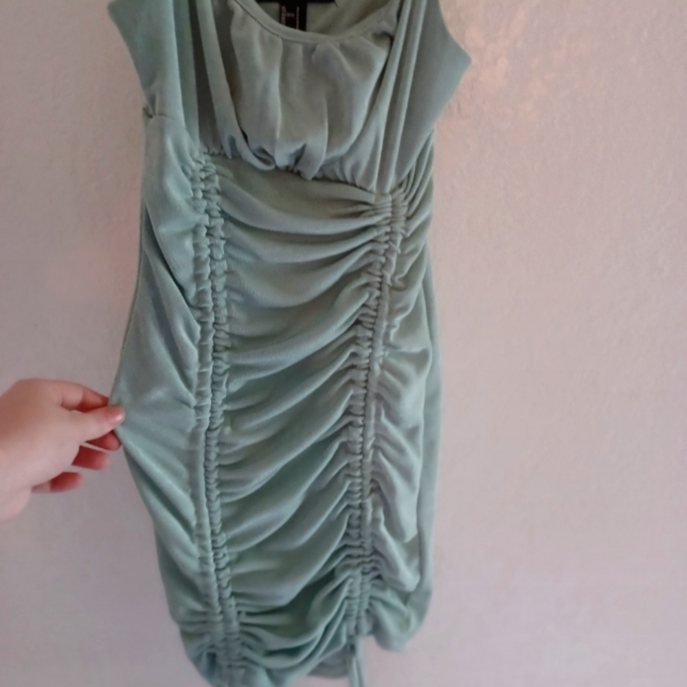 Forever 21 lightblue/turquoise dress that sinches up . Size small